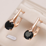Elegantes brincos de ouro com zircônia negra