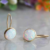 Brincos vintage em ouro com pedra opala